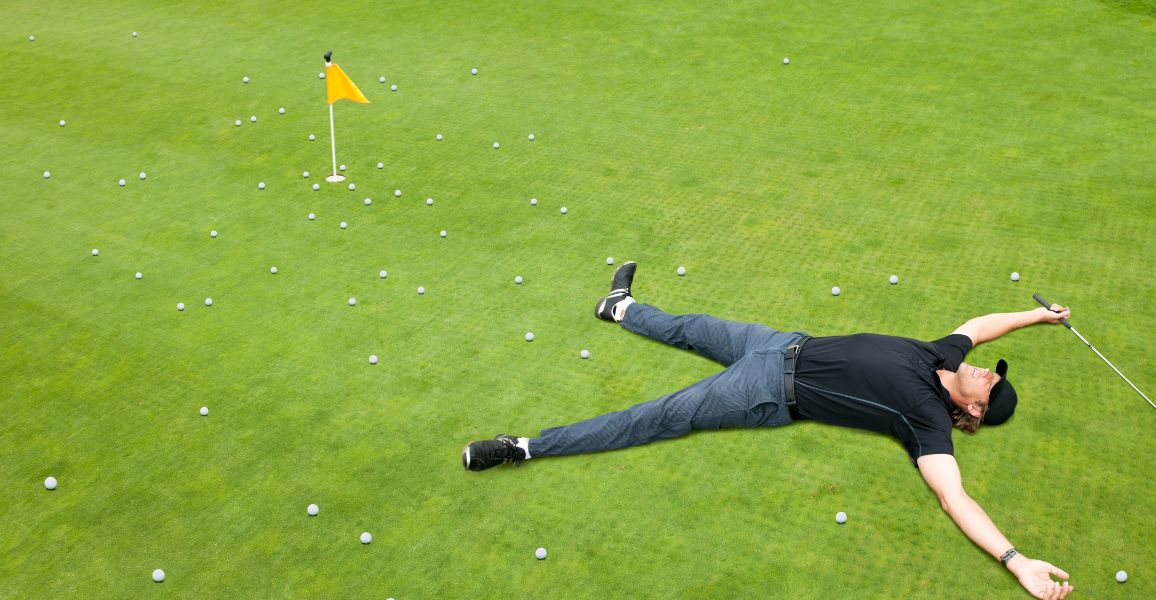 golfer laying on a practice green with golf balls wondering how long it will take to get good