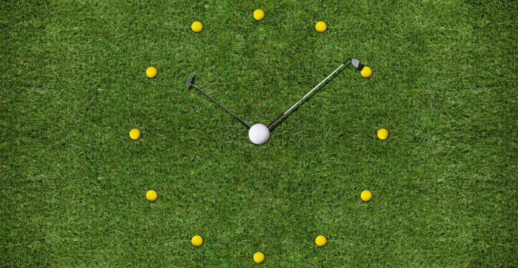 Two golf clubs making a clock on the fairway showing a golfer's tee time