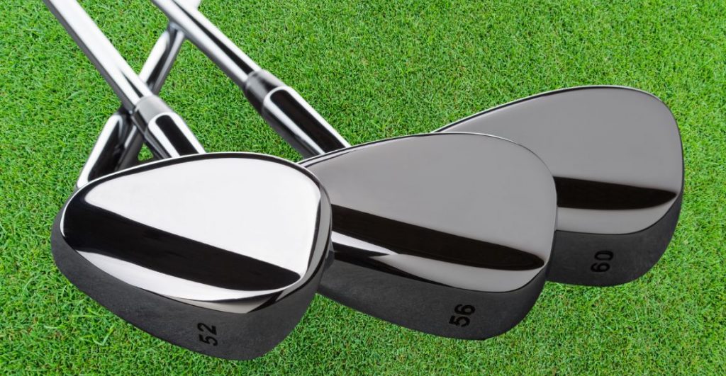 three golf wedges with the degrees of loft at the end of the golf club