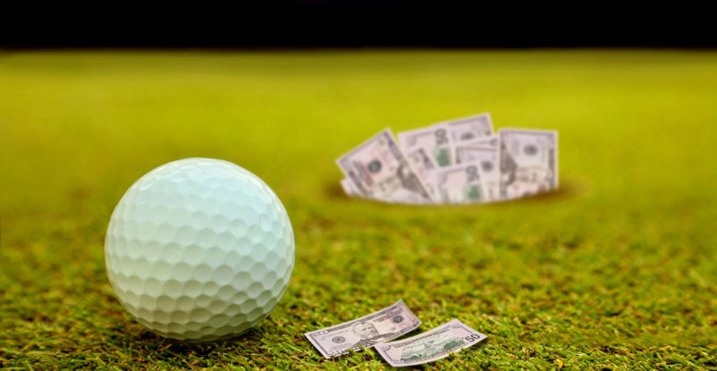 Golf ball on a putting green surrounded by dollar bills